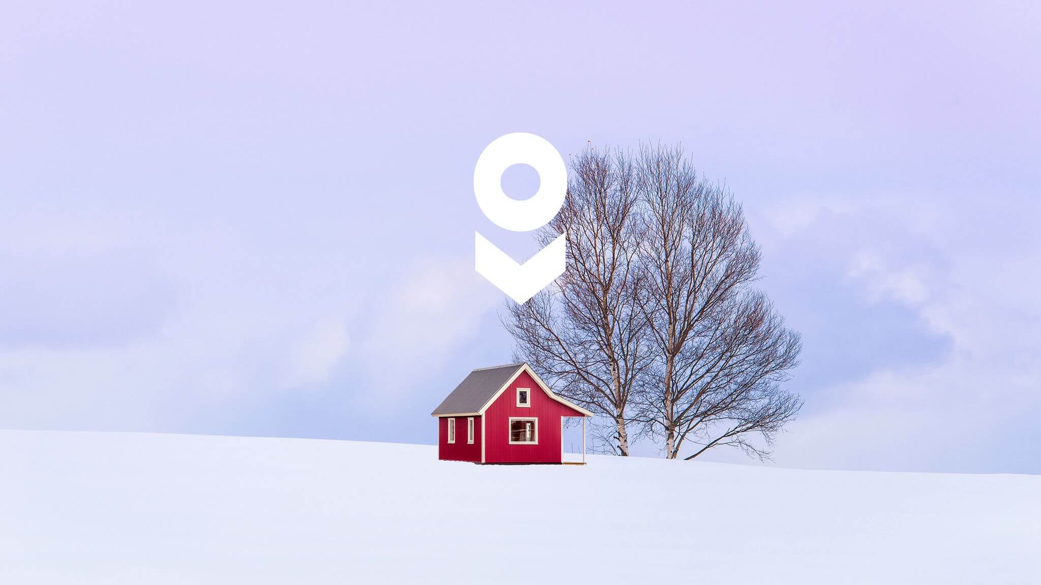 Isolated house with tree in snowy countryside